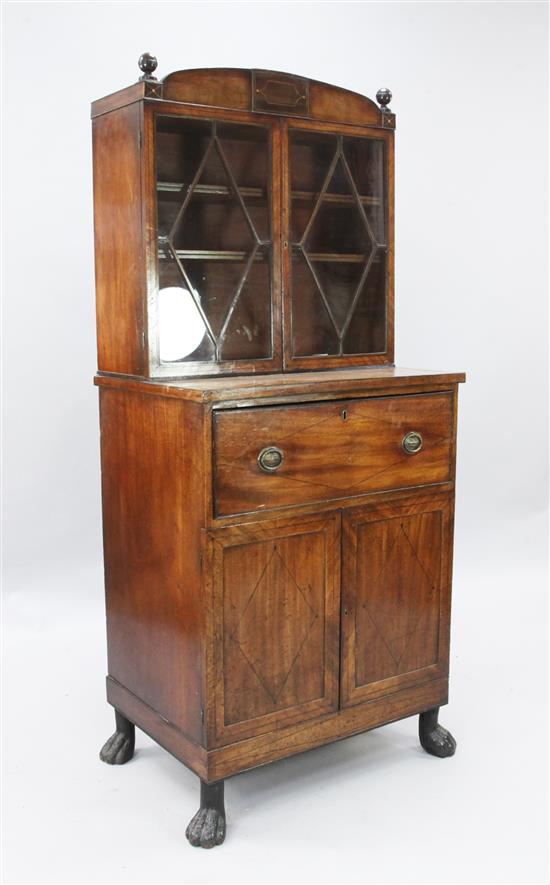 A Regency ebony and boxwood strung mahogany domed top secretaire cabinet, W. 2ft 5in. D. 1ft 8in. H. 5ft 6in.